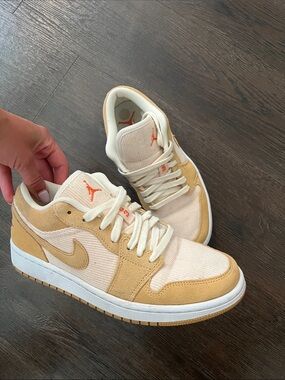 Nike Women’s Low-Top Sneakers in Cream and Tan with Orange Logo